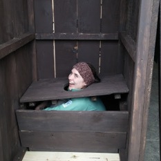 Marlena testing out one of the outhouses, photo by Michaela Aney