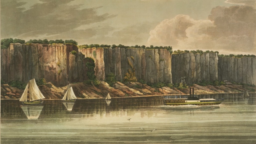 A color print of the Palisades cliff face, dating back to approximately. 1823. In the foreground is the Hudson River with a steamship and several sailboats. On the top of the cliff face there is a line of green trees. The sky of the print is a blue-grey with soft white and grey clouds.